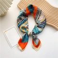 Elegant orange and blue silk square scarf with vintage court pattern in a folded knot - Retro Chariot Orange