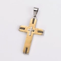 Detailed macro view of two-tone stainless steel cross pendant with Greek key pattern - Medium / No Chain / Two-tone (Gold & Silver)
