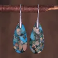Macro shot of blue imperial stone teardrop earrings hanging on a natural wooden branch - Blue Gravel Mosaic Style (ER1025-10)