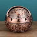Bronze spherical metal ashtray with Fu character relief and lid on wooden surface - Red Copper Blessing Characters