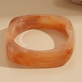 Close-up of wide square amber resin bangle with marbled orange and brown textures - Irregular Square Amber Marble Resin Bangle (Coffee-Square)