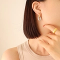 Textured gold and silver twisted oval earrings paired with a wide striped gold ring - F405-Gold & Steel
