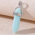 Light blue hexagonal crystal column pendant with silver metal bail on a textured background - Luminous Light Blue