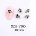 Macro detail of 10x5mm heart-shaped nail crystal with grey facets and gold base - Dark Gray Heart Style (9365)
