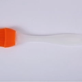 Orange silicone pastry and BBQ oil brush with a translucent white ergonomic handle - Orange
