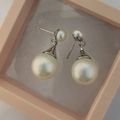 Elegant French vintage earrings featuring freshwater pearls in a pink jewelry box - White