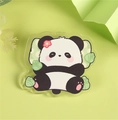 Cartoon panda acrylic brooch with pink flower and green cushion on light green background - Lying Panda