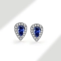 Macro shot of silver teardrop stud earrings featuring a blue pear-shaped center stone - 925 Silver / Royal Blue (September)