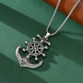 Macro view of vintage silver anchor and rudder pendant with oxidized texture and metal chain - Small Anchor Pendant
