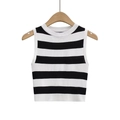 Detailed view of sleeveless black and white striped knit tank top on wooden hanger - Black & White Stripes