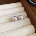 Macro detail of silver brushed round stud earring with textured matte metallic finish - 58# Silver 10mm Brushed Ball Silver Earring Post
