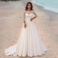 Elegante witte kanten trouwjurk met lange satijnen sleep en driekwart mouwen - US size 2 (S) / Ivoor