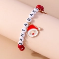 Close-up of Santa Baby beaded bracelet with red pearls and Santa Claus charm - Red/White Beads-SANTA BABY Letters