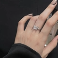 Close-up of silver butterfly ring with sparkling cubic zirconia on model's finger - Adjustable Open / Dainty Butterfly-Side Diamond Detail (JZ3929)