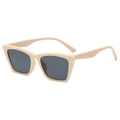 Fashionable beige cat-eye sunglasses with dark grey lenses in a 45-degree side view - Ivory White Frame Grey