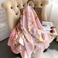 Elegant light pink silk scarf with almond blossom print draped on a chair - 90*180cm / Pink