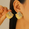 Detail of large gold shell earrings with silver coral accents and white pearls on model - Shell Coral Stud Earrings (6754)