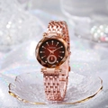 Detailed macro view of rose gold quartz watch featuring a gradient brown diamond dial - Red Dial