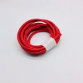 Macro detail of red 6mm round leather cord with visible stitching for DIY bag making - Red