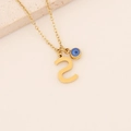 Collier minimaliste avec lettre S dorée et pendentif œil bleu sur chaîne fine - S