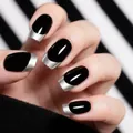 Detail of French almond press-on nails with glossy black base and silver glitter tips - Black and Silver Glitter French Style (CW662)