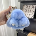 Macro detail of a soft light blue faux fur rabbit keychain with a golden metal hook - 10cm Bunny / Sky Blue