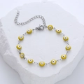 Detailed close-up of yellow Evil Eye charm bracelet with stainless steel lobster clasp - Yellow