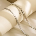 Close-up of silver stainless steel snake chain with lobster clasp and S.STEEL tag - 4mm Width 40cm Length / Silver