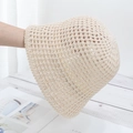 Close-up of the breathable hollow knit texture on a beige handmade straw bucket hat - Adjustable / Beige