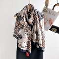 Elegant cream paisley silk scarf with navy patterns hanging on a wooden hanger - Navy White Paisley / 180*90