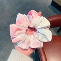 Detail of pink tie-dye velvet scrunchie showing fabric texture and elastic stretch - Pink White