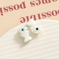 Macro view of handmade glass fish pendants with wave textures and gold hanging loops - 3D Color Matching Fish / Milky White and Blue