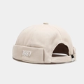 Detail der beige Docker Mütze mit 1987 Stickerei und verstellbarem Riemen aus Metall - Verstellbar / Beige