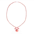 Close-up of a glowing transparent reindeer pendant on a red cord festive necklace - Reindeer Head Cord Necklace