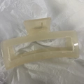 Macro view of extra-large cream translucent rectangular claw clip for thick hair - 13cm / Jelly White