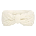 Close-up of white knitted ear warmer headband showing thick wool texture and twist detail - White
