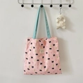 Detail of pink bubble fabric tote bag with blue straps and cute embroidered bear pattern - Black Cat Pear