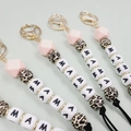 Detail of MAMA silicone bead keychains with leopard print and golden lobster clasp - Pink Leopard Silicone Beads