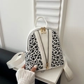 Mini white leather backpack with leopard print panels and golden V-shaped zippers - White
