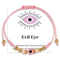 Pink evil eye braided bracelet with gold beads on white presentation card - Pink