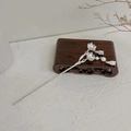 Detailed view of silver flower hair pin with pearls on a vintage wooden base - Small Silver Lotus
