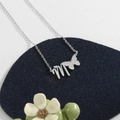 Silver stainless steel butterfly necklace with letter M pendant on blue velvet pad - Silver M