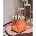 Borsa a secchiello minimalista in pelle arancione con doppi manici sottili - Arancione