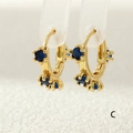 Golden hinged hoop earrings with three prong-set blue zircons in a classic round cut - Blue Gemstone Style (ER0748-C)