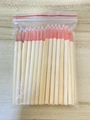 Disposable bamboo eyelash brushes with pink heads packed in clear plastic bags - Orange Bamboo Micro Swabs