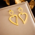Macro shot of double heart-shaped gold-plated stainless steel earrings on luxury stand - Heart Hollow Mandala Style (E5756 Gold)