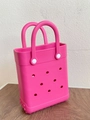 Detail view of the rose red EVA beach bag showing hole patterns and handle attachment - Rose Red