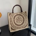 Linen tote bag with brown mandala pattern and round handles in a minimalist setting - Round Pattern Linen Pocket / Brown