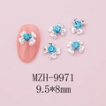 Macro view of silver bow nail jewelry with a heart-shaped blue crystal, size 9.5x8mm - Silver Bow + Blue Heart Stone (9971)