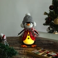 Detail of glowing penguin Christmas plush toy with warm LED light in soft fabric - Grey Hat LED Glowing Penguin